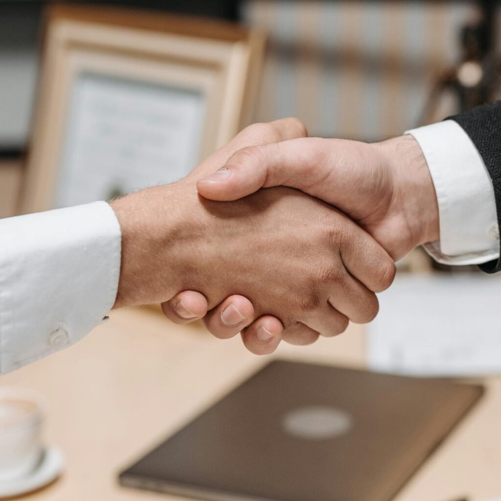 International business partnership and collaboration handshake