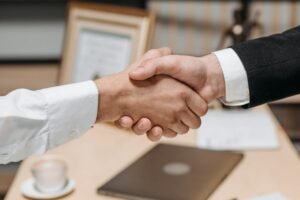International business partnership and collaboration handshake